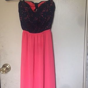 A long coral and navy blue dress.